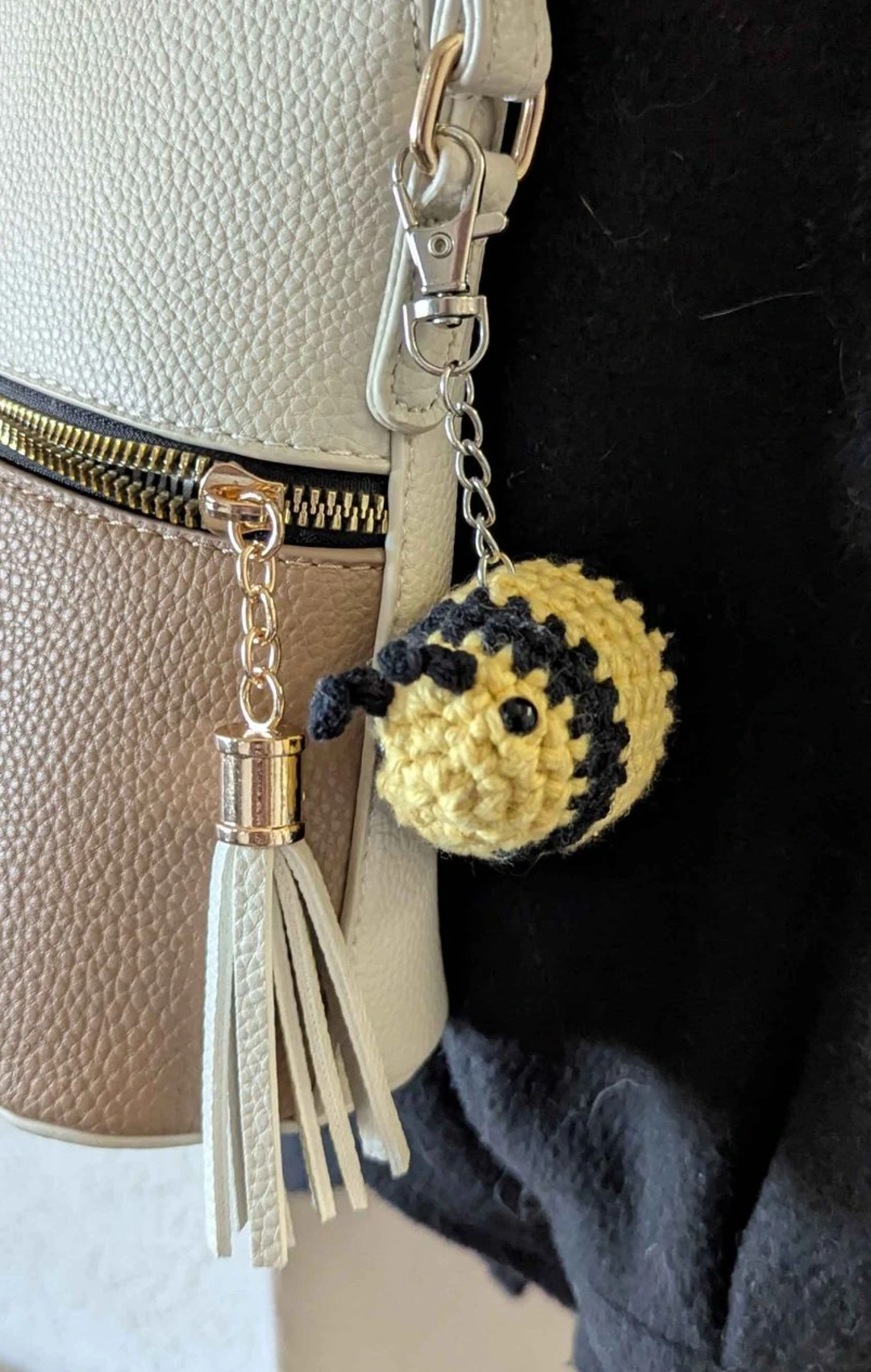Bumblebee keychain hanging off a purse